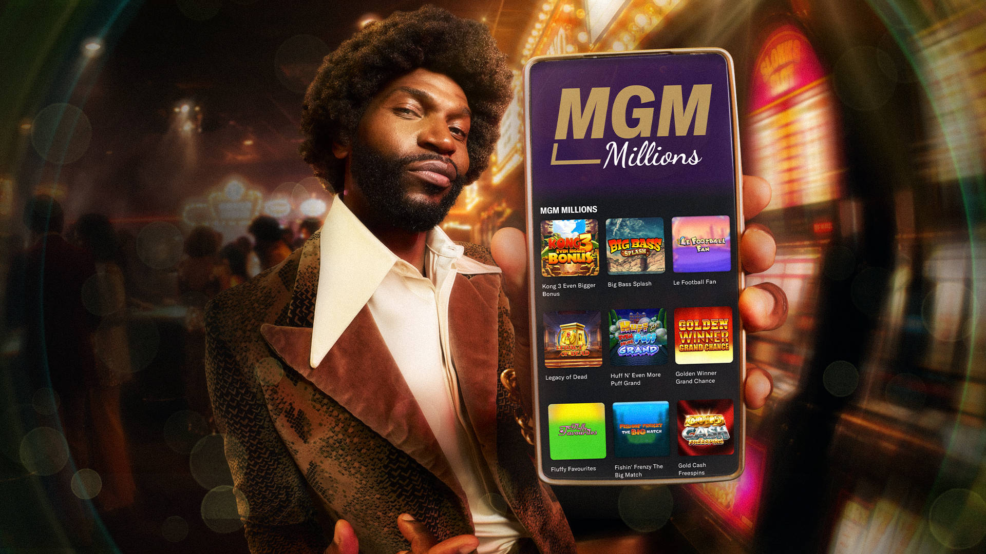 man holding up a smartphone displaying MGM Millions