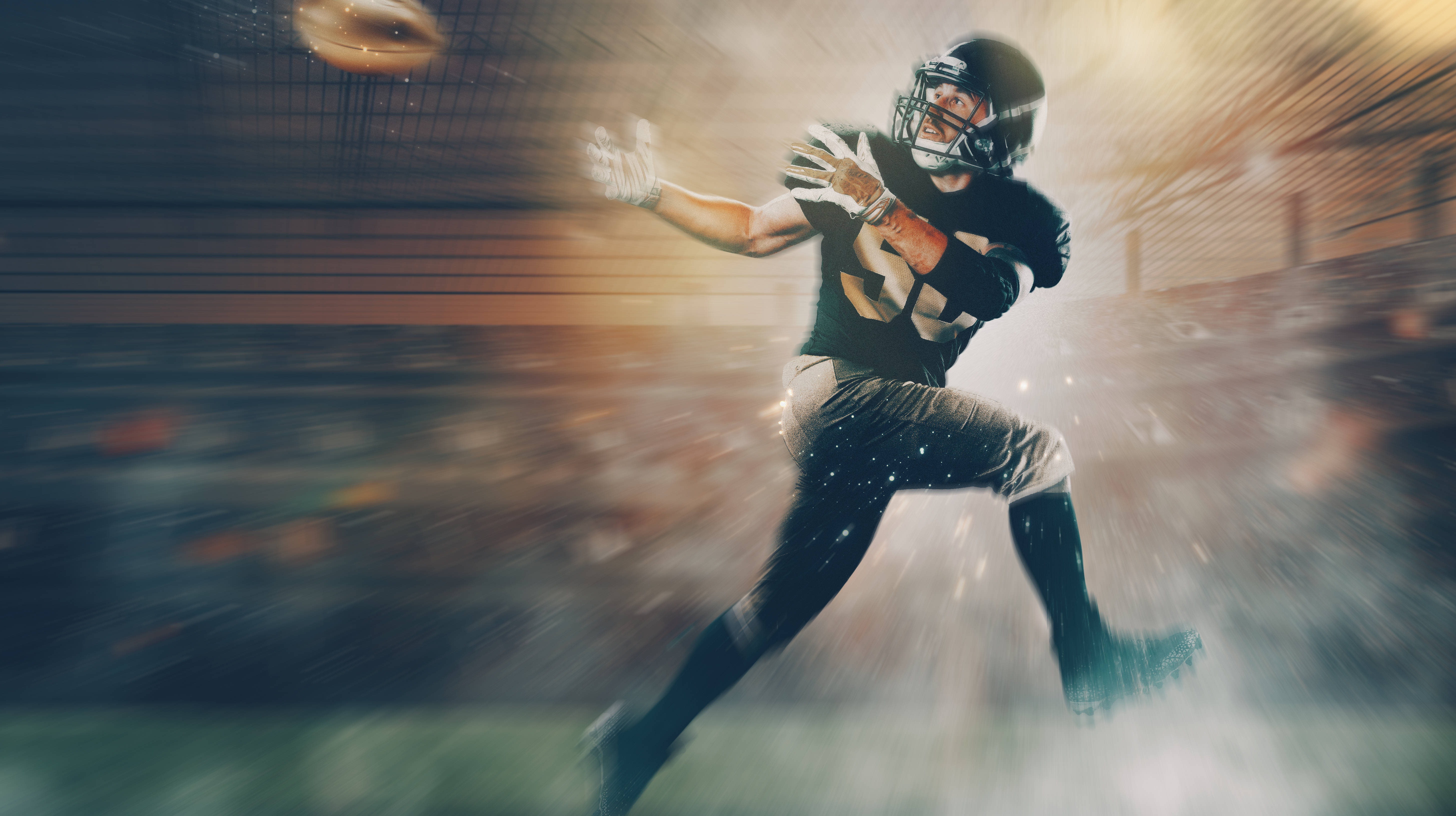 NFL player about to catch ball