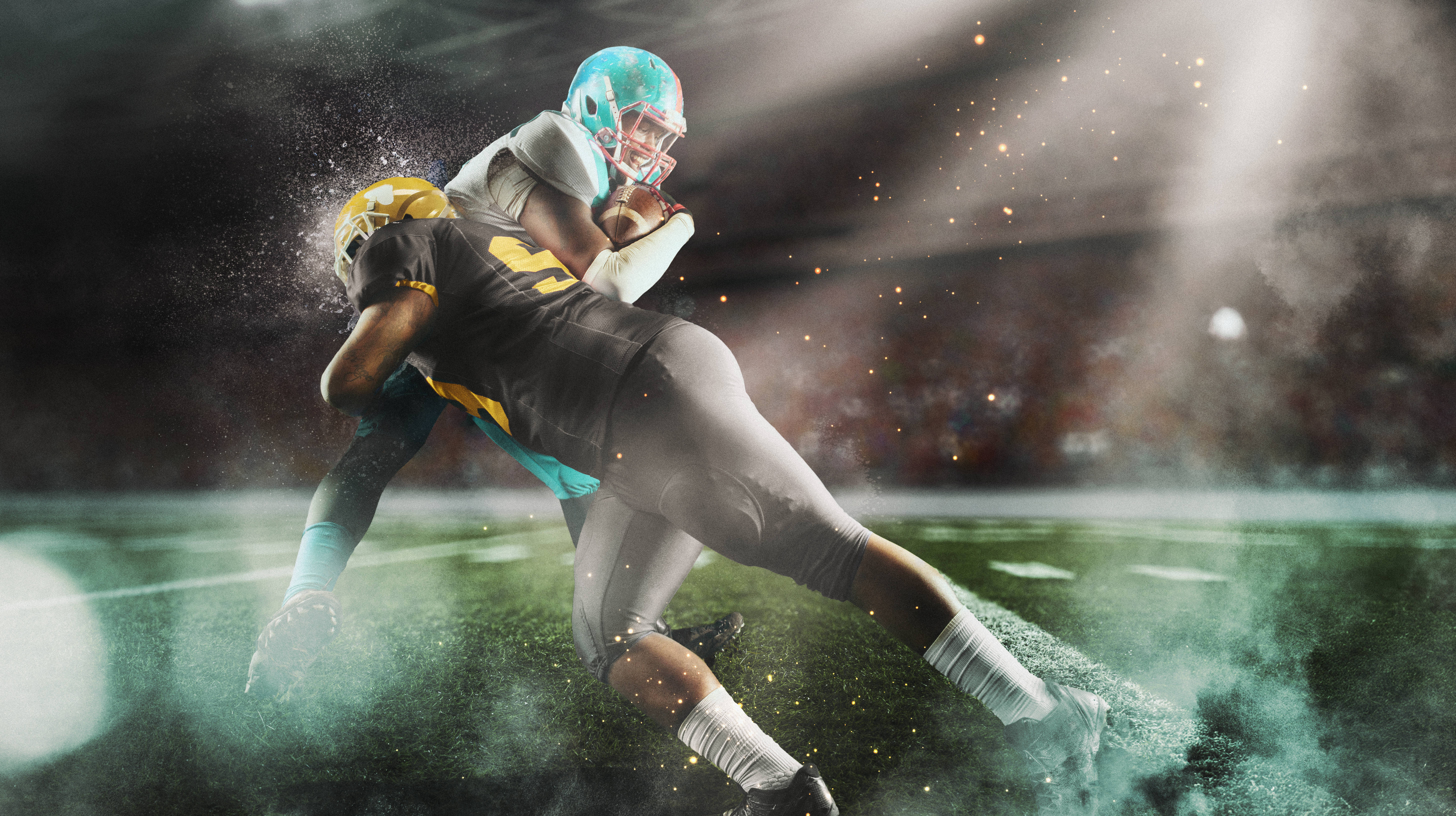 American Football player tackling another to the ground