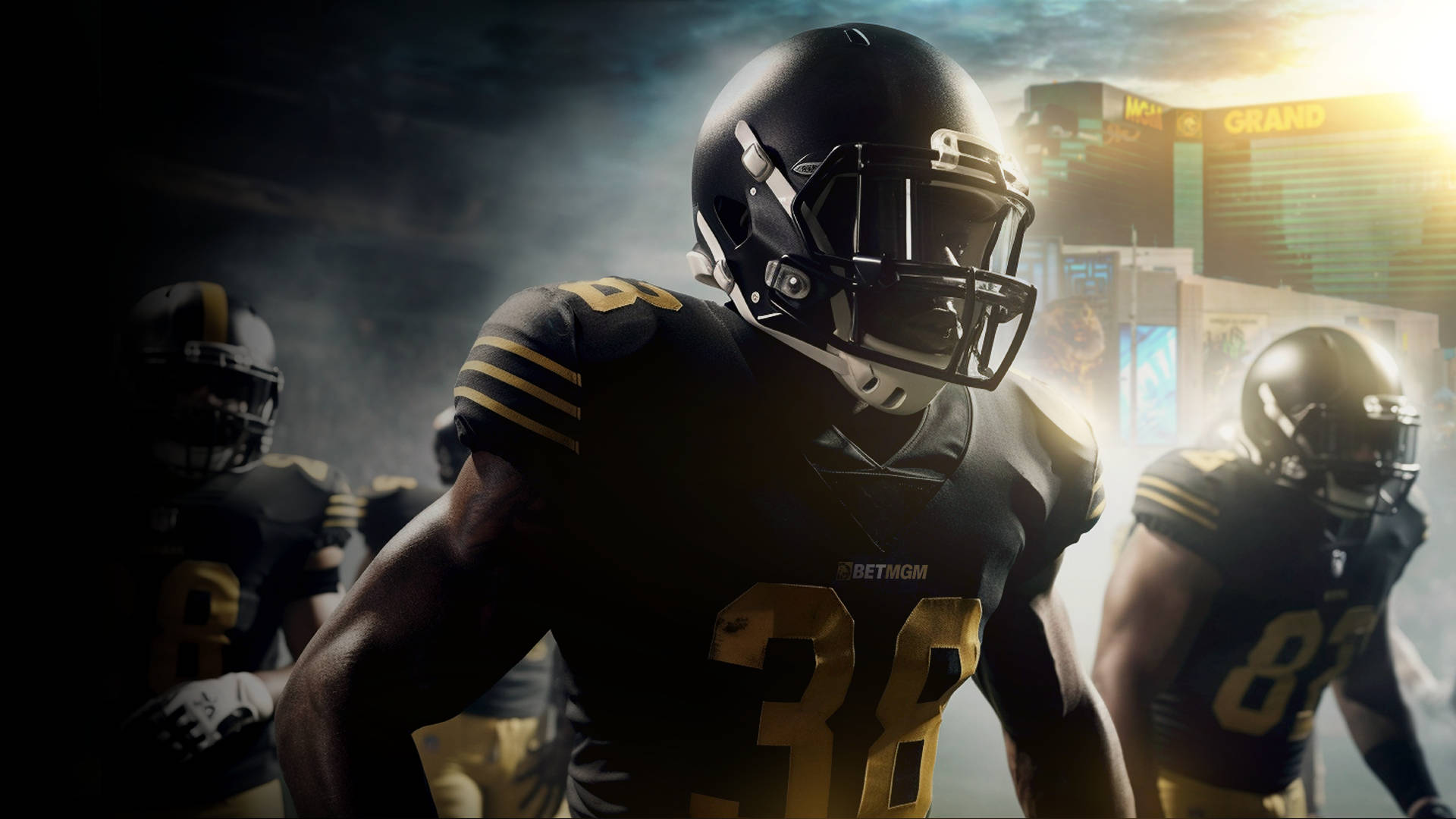 Four American football players in front of a Las Vegas hotel.