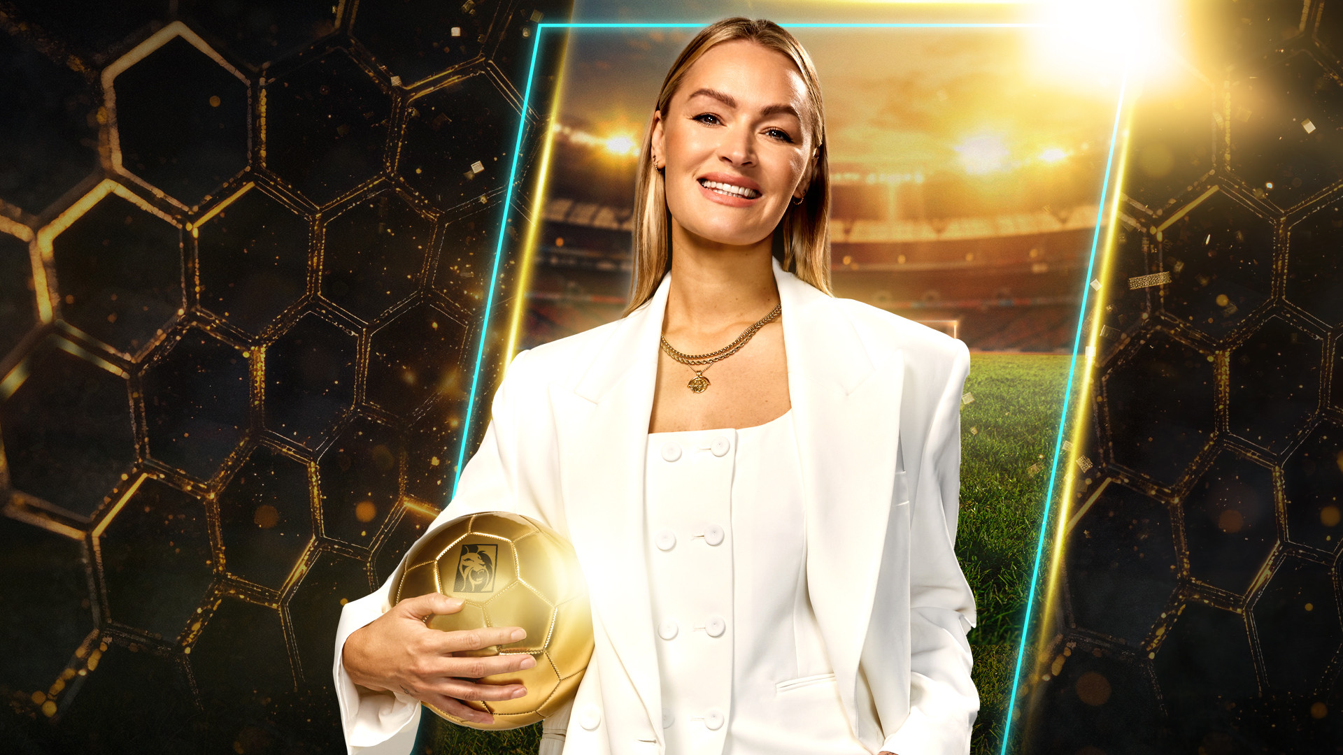 Laura Woods holding golden football and smiling