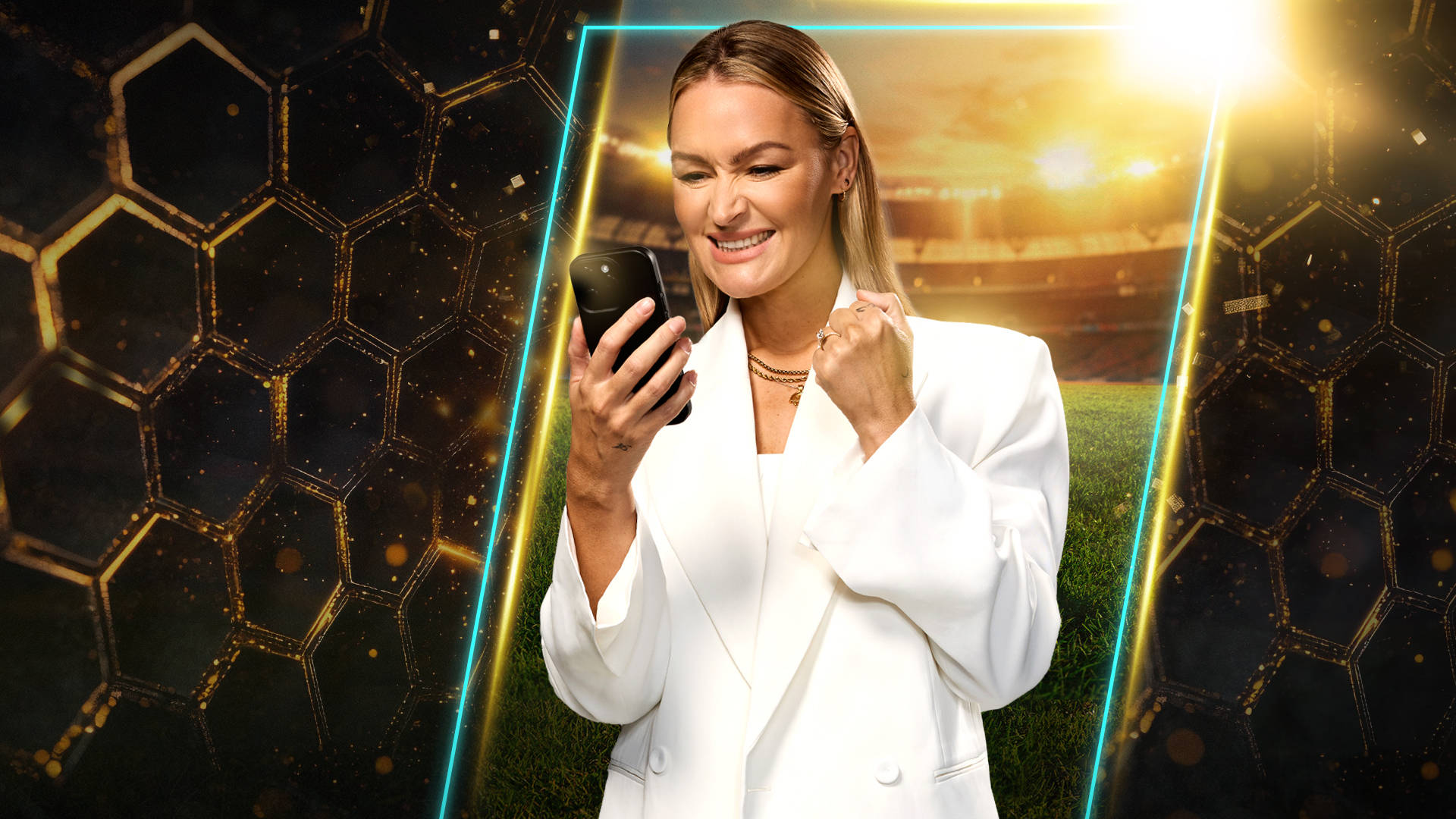Laura Woods looking at phone and celebrating
