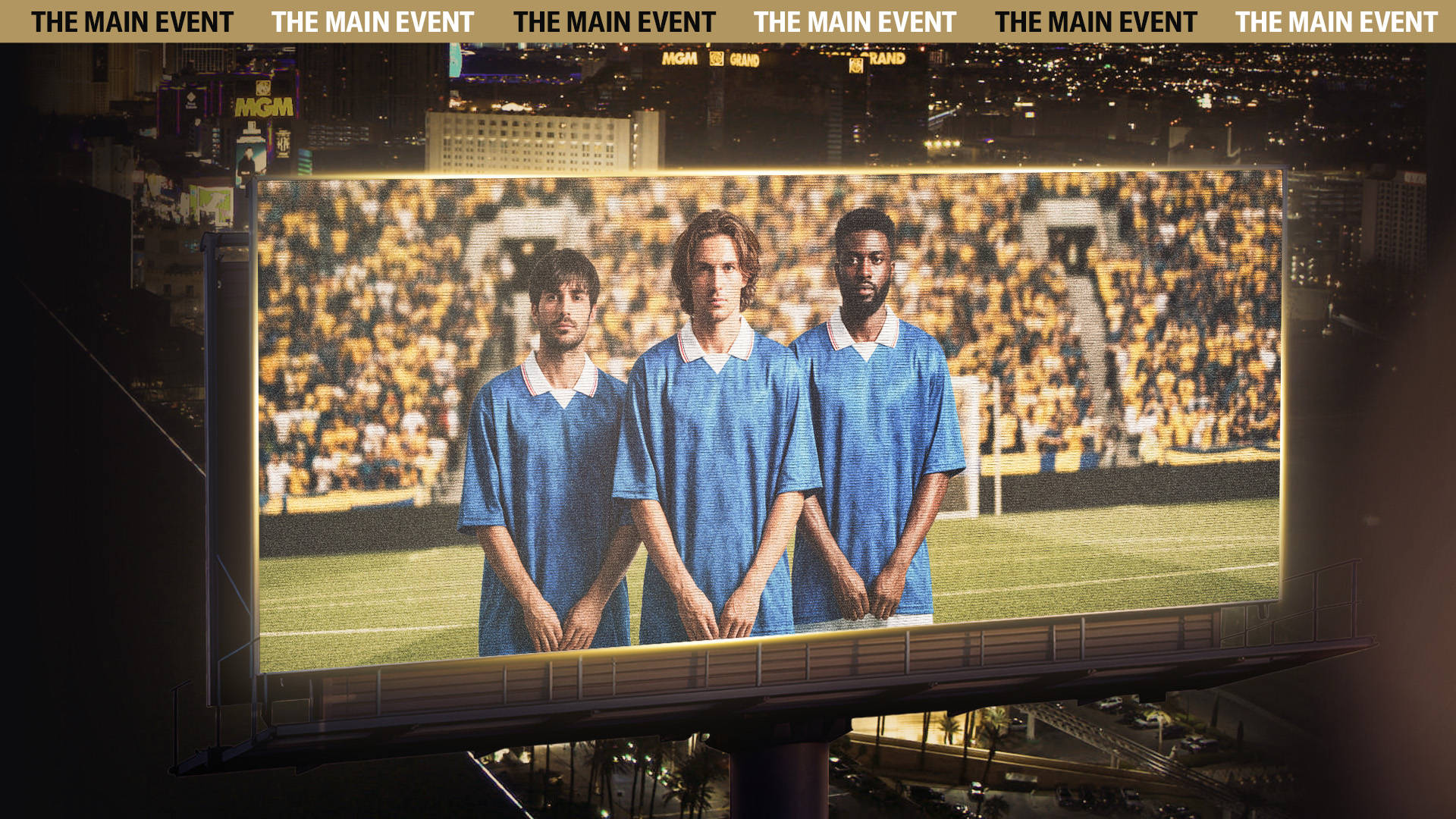 Three players in blue shirts on a big screen