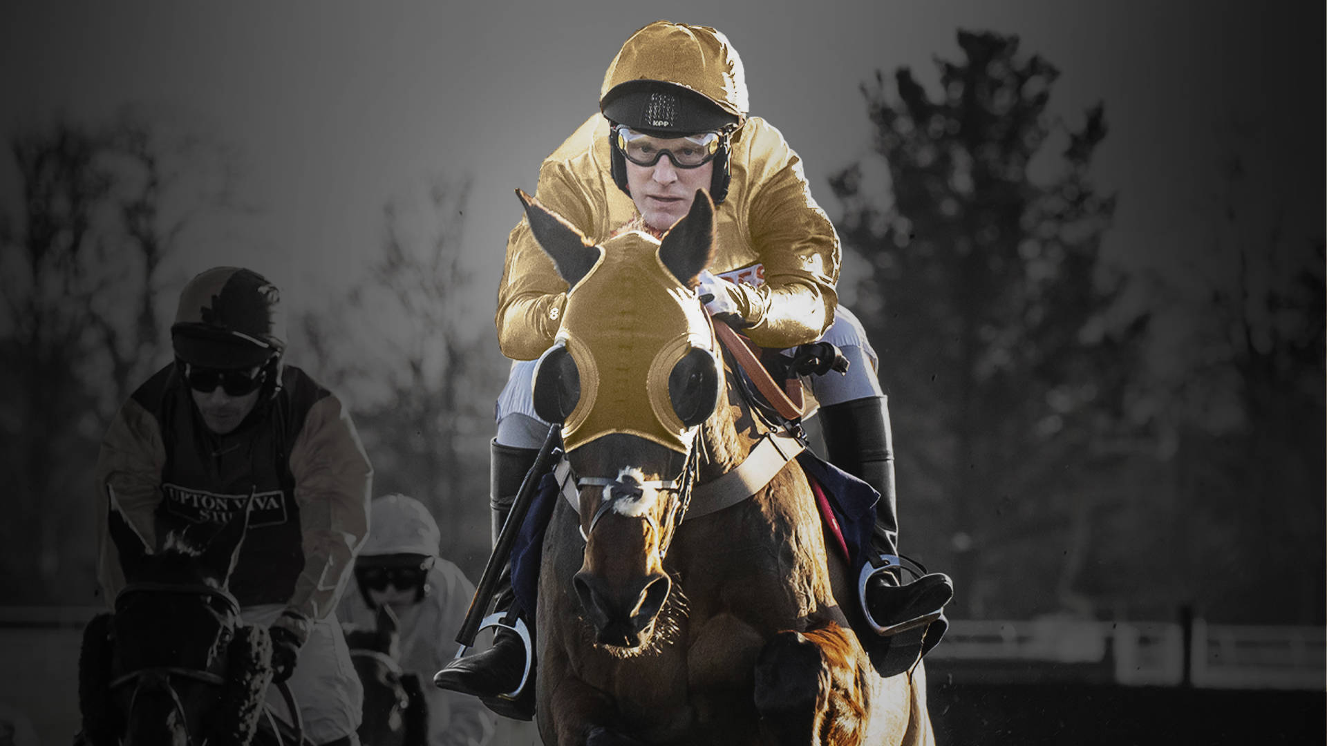 A horse race with a jockey in gold silks and a horse wearing blinkers.