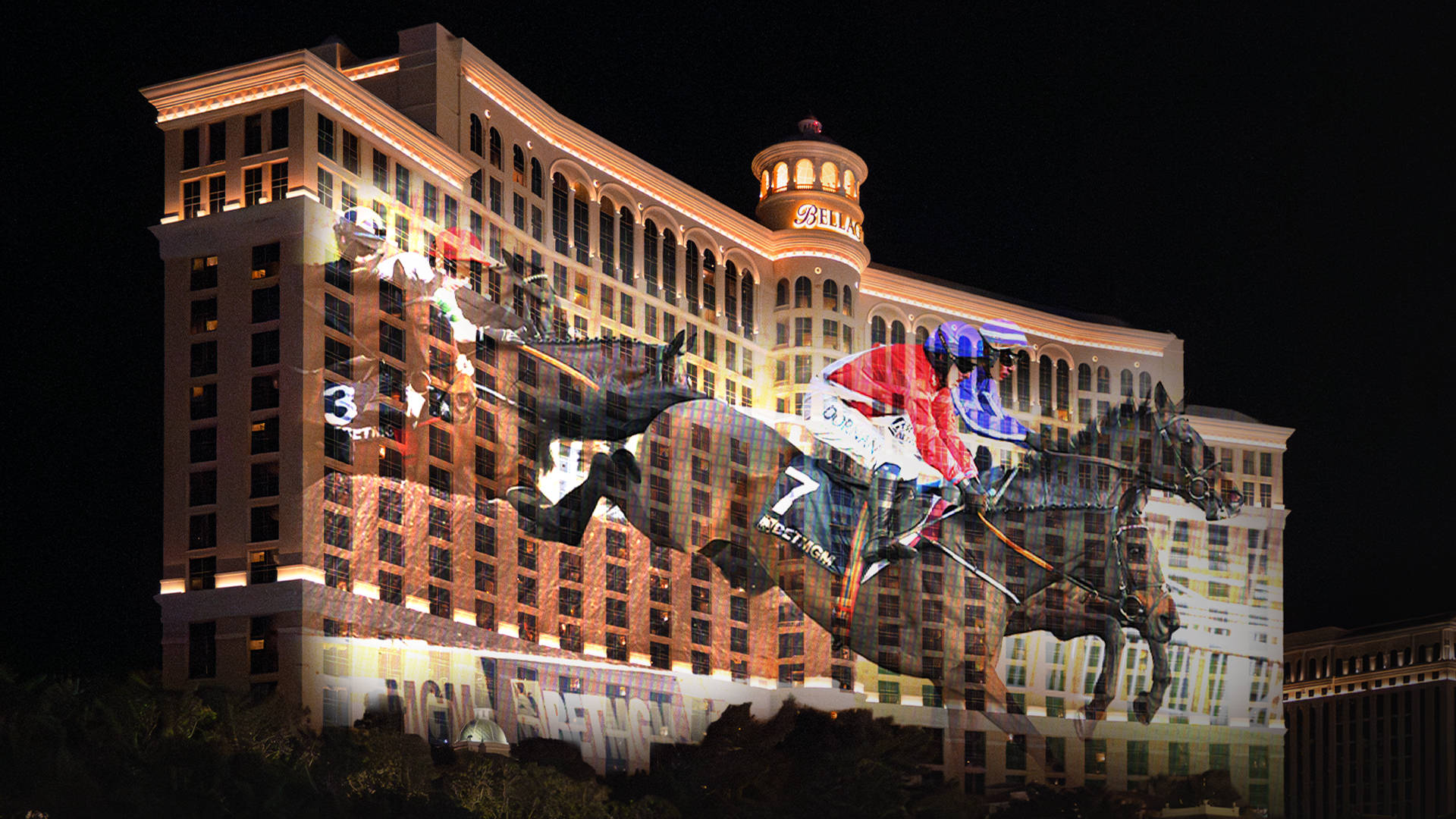 A horse and jockey race in front of a BetMGM banner with a Las Vegas skyline in the background.