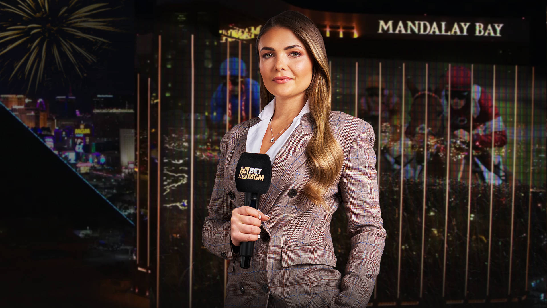 Woman with BetMGM microphone in front of a Las Vegas building