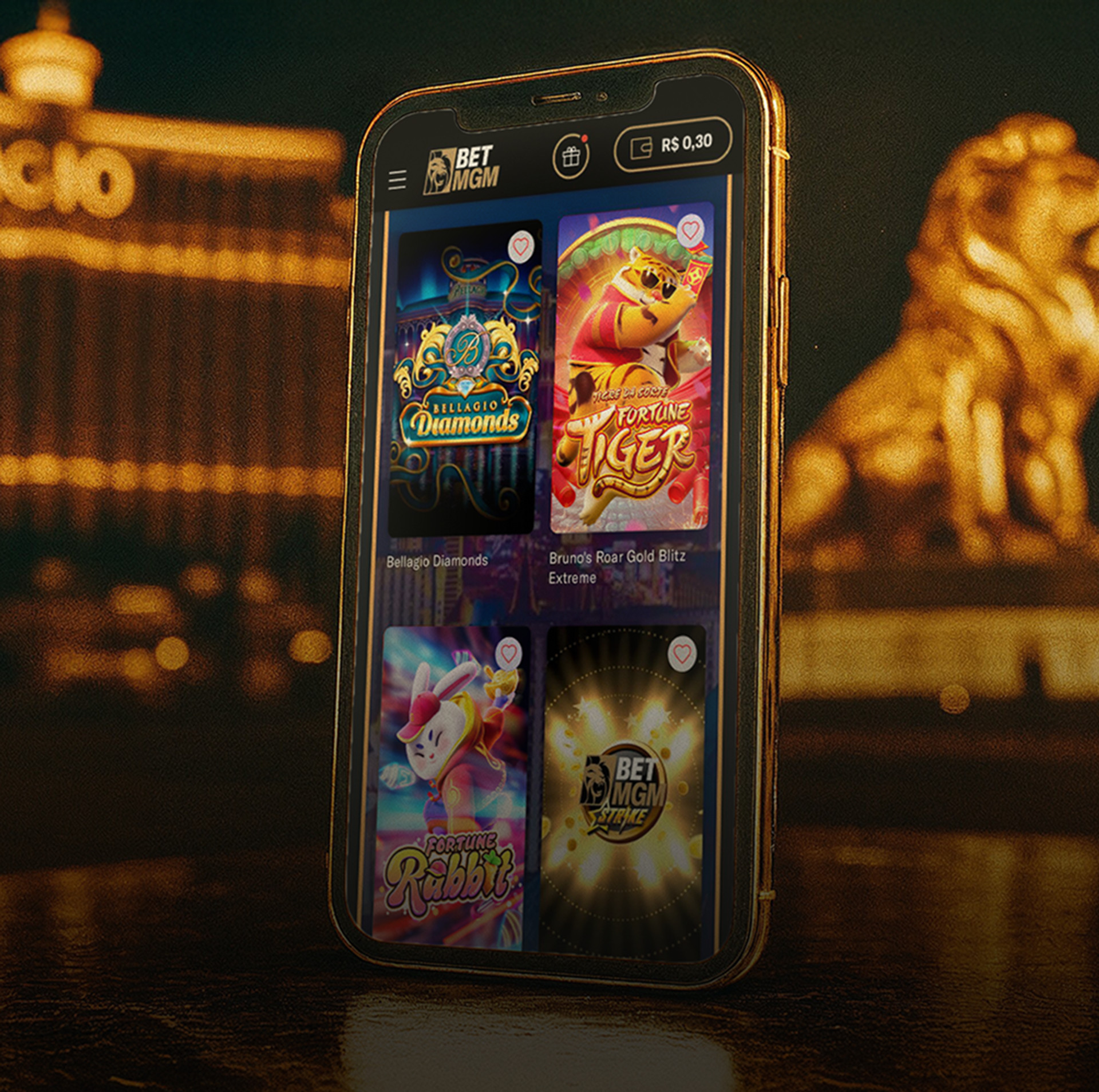 Celular BetMGM exibindo jogos: Bellagio Diamonds, Fortune Tiger, Fortune Rabbit e um jogo BetMGM.
